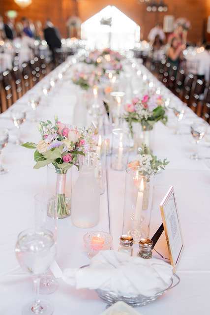 romantic wedding flowers gold stand centerpiece